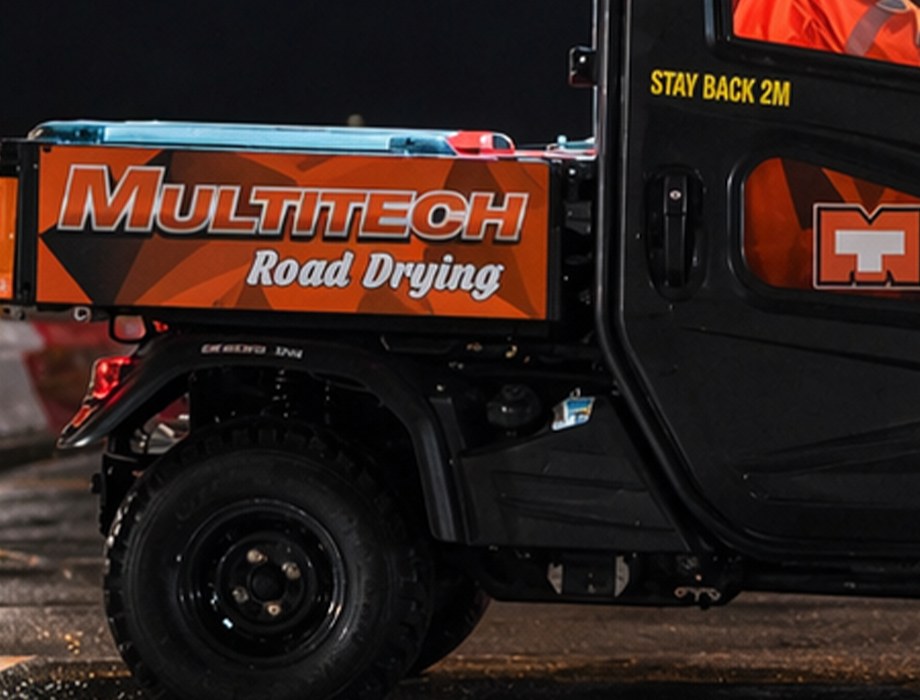 Multitech Road Drying livery on the machine at a night worksite